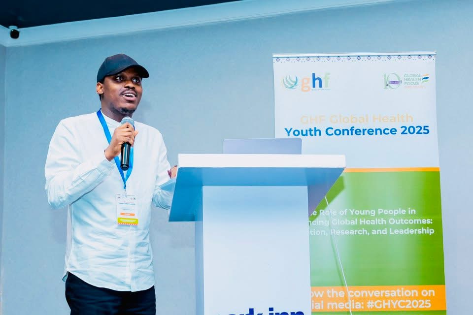 Yusuff Adebisi speaking at the GHF Global Health Youth Conference 2025